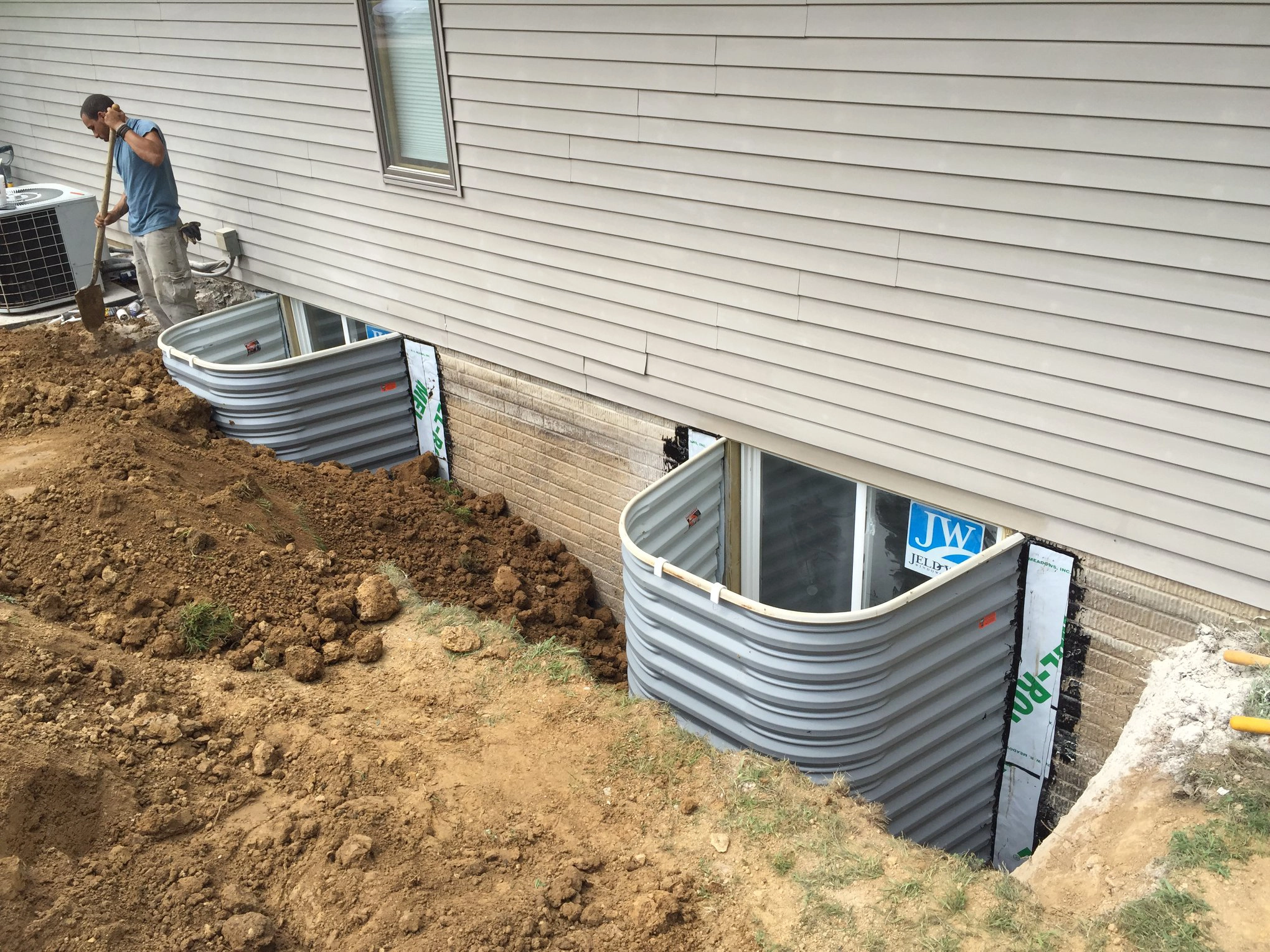 in process shot of installation of basement egress windows springfield illinois