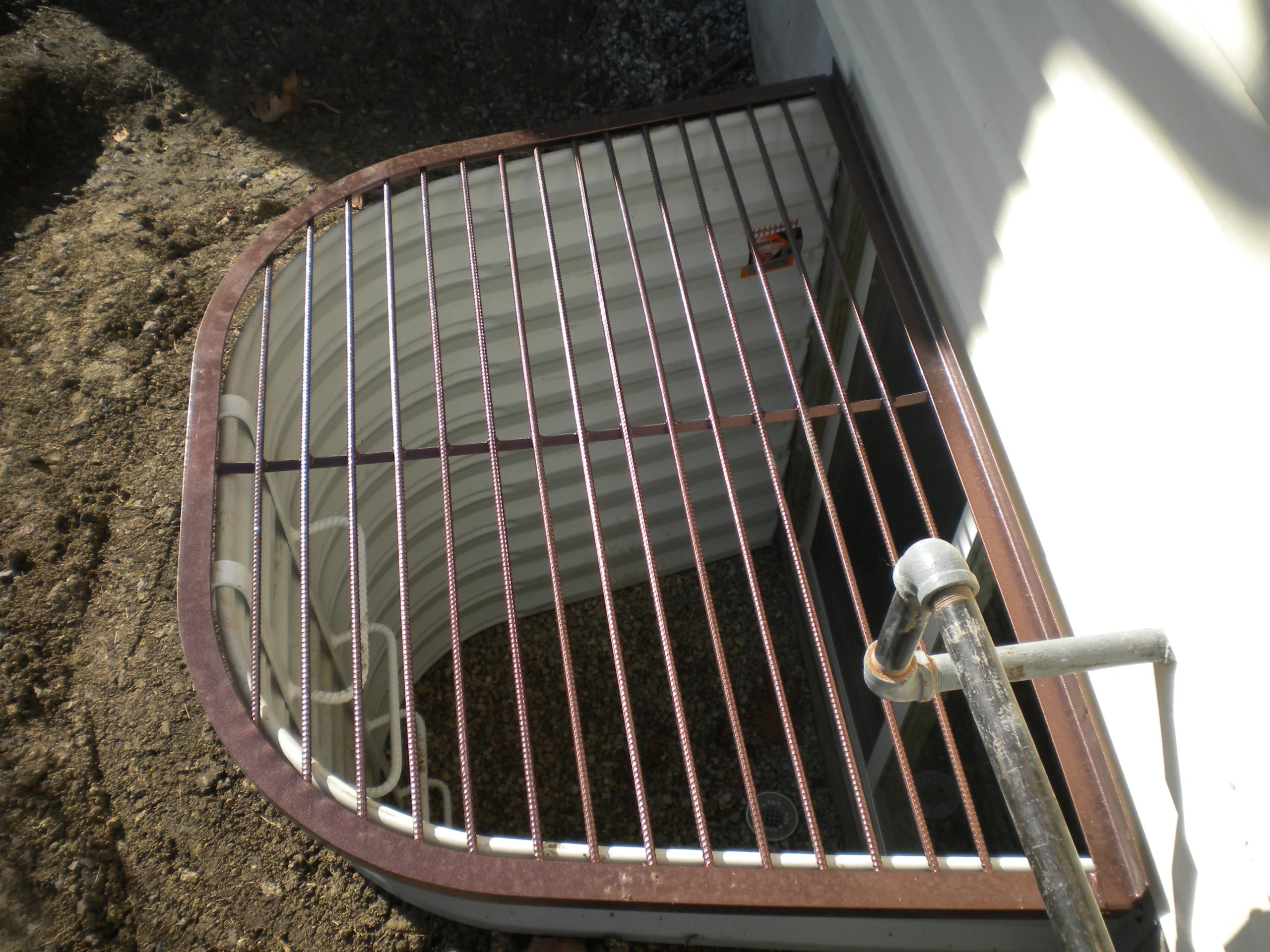 window well and egress window with a grate cover springfield il