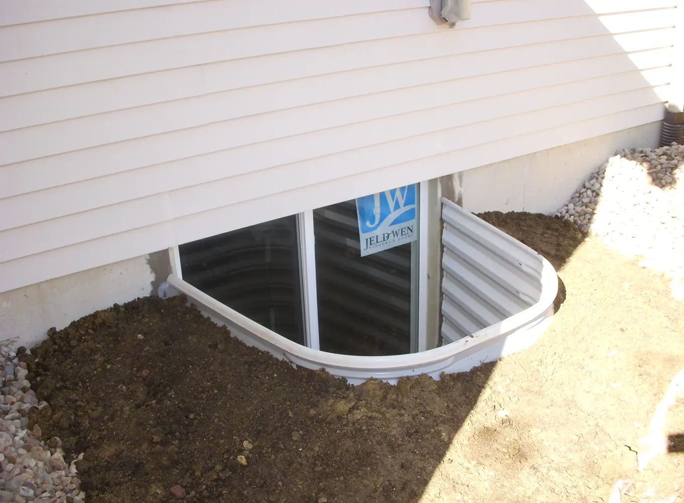 basement egress windows and window well with a drainage solution springfield il